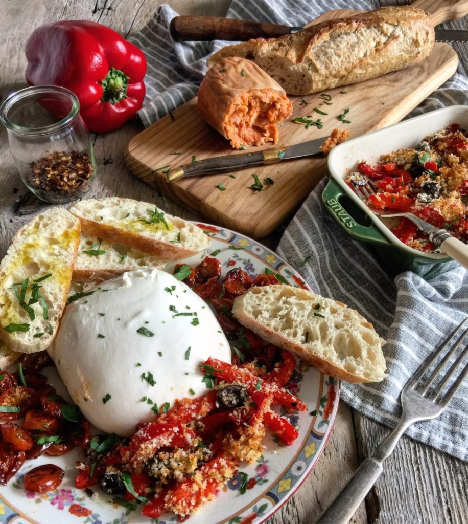 Roasted Red Pepper Gratin is served up with burrata, sausage, and baguette.