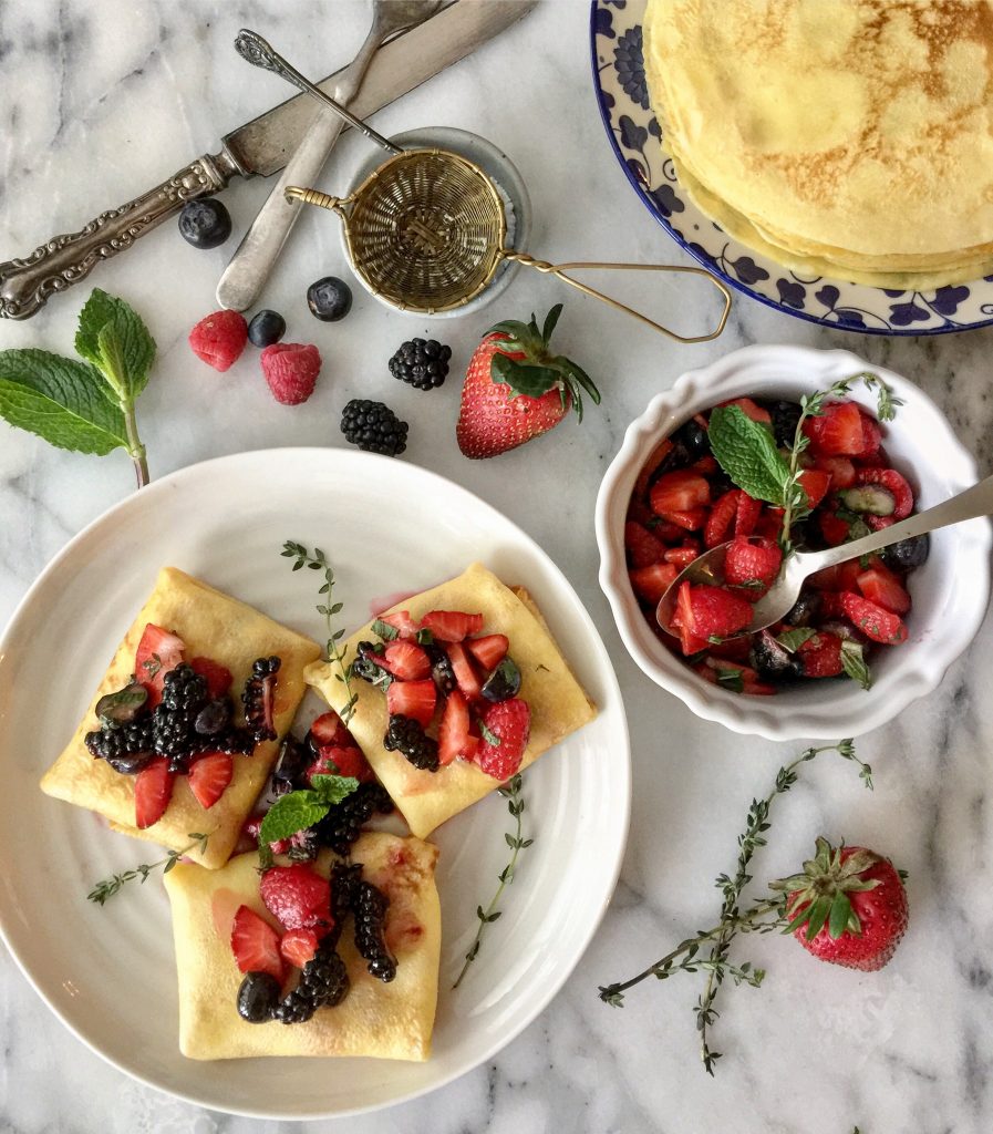 Sweet Ricotta blintzes with macerated berries