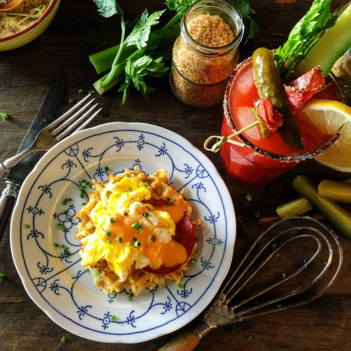 Canadiana Bloody Caesar with Frambled Eggs and Peameal Bacon on Hashbrown Waffles