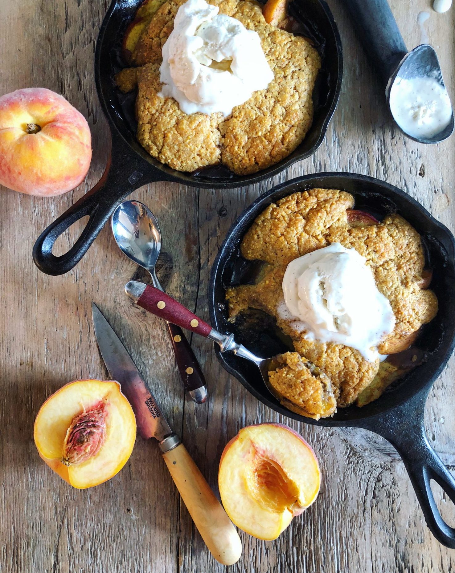 Spicy Maple Bourbon Peach Cobbler with Cornmeal Biscuit Topping