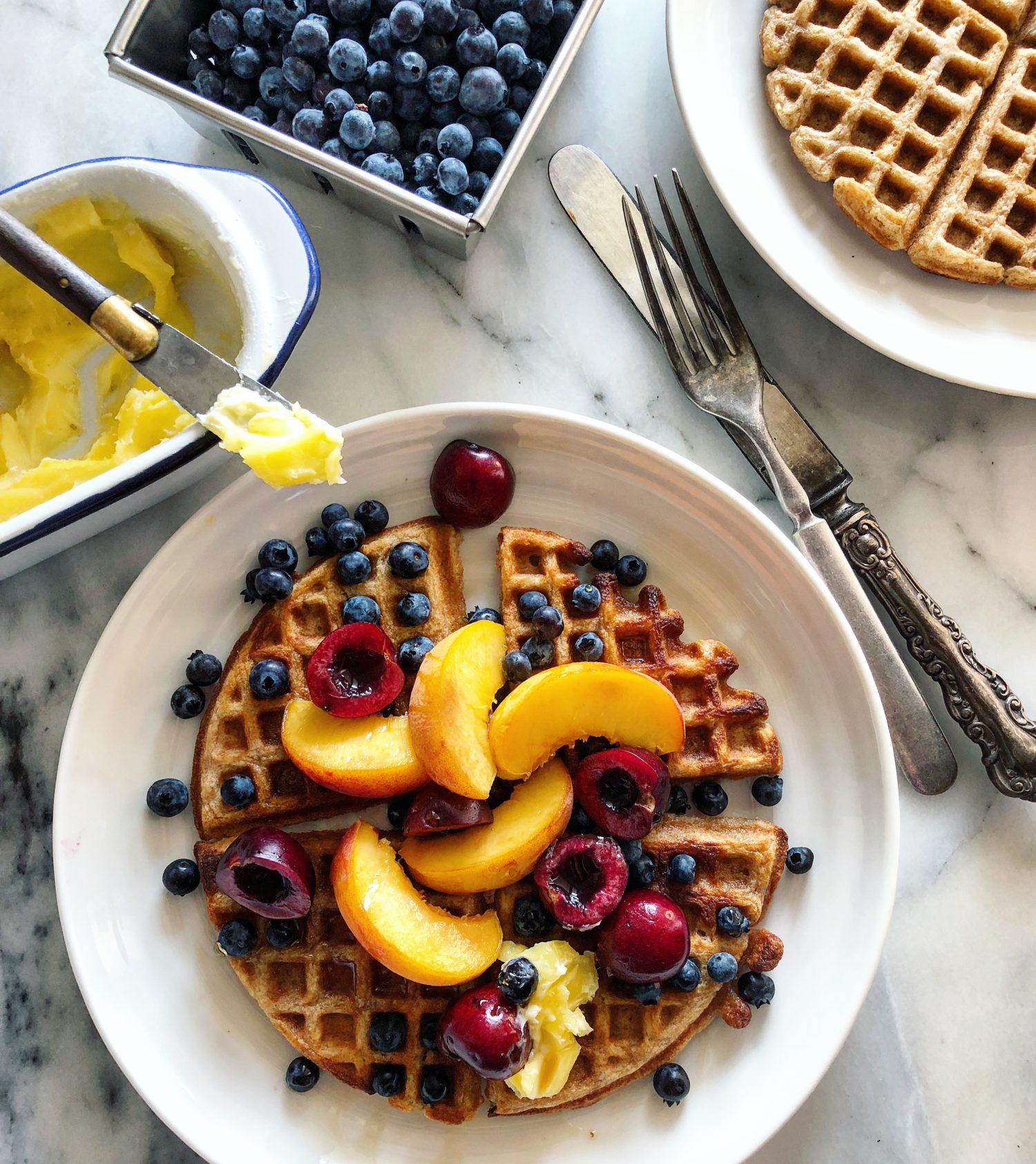 Peaches and wild berries on Earl Grey Waffles