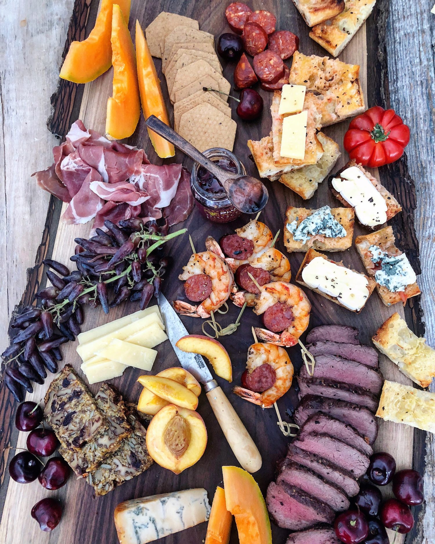 Summer Grilling Cheeseboard with venison, shrimp and pan con tomate