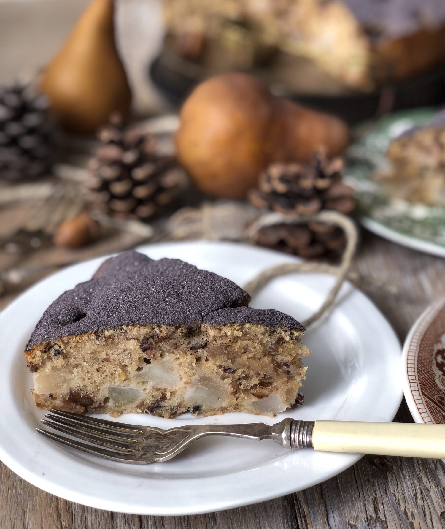 tender Pear and Chestnut cake dusted with cocoa powder