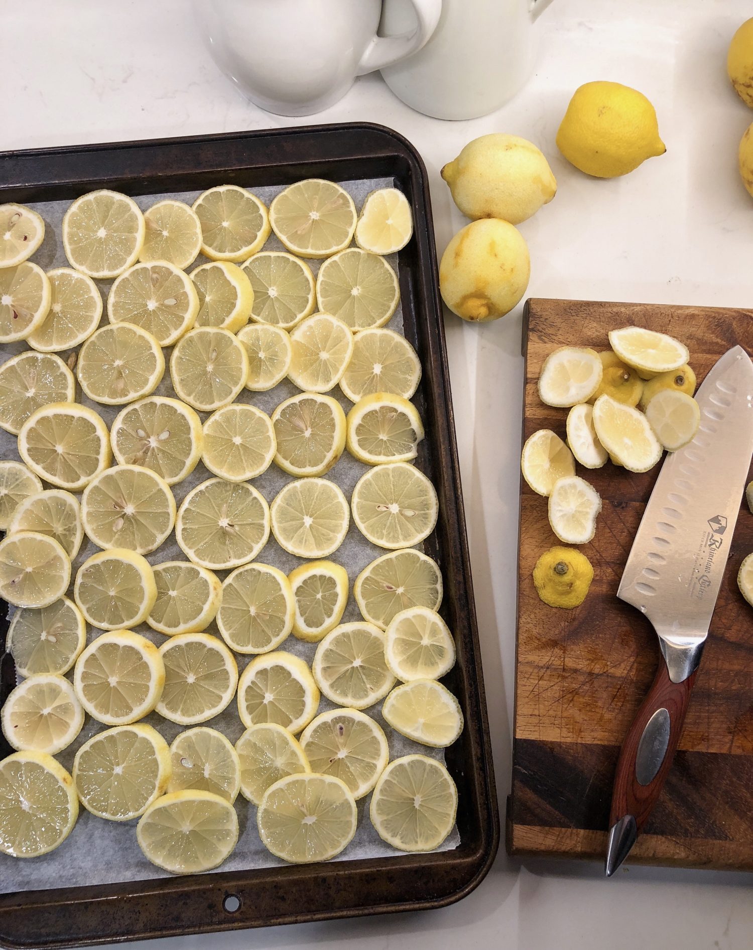 Lemon prep, lemon slices, baking sheet