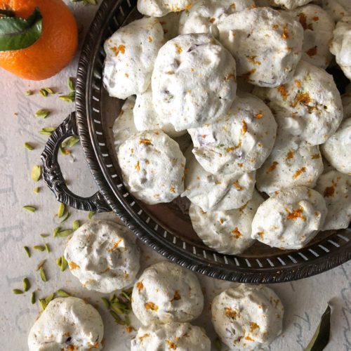 tender orange, pistachio and chocolate meringue cookies, forget-me-nots
