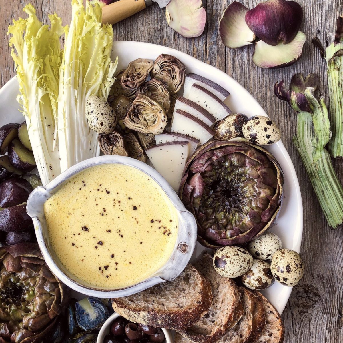 Purple Artichokes with Hollandaise, quail eggs