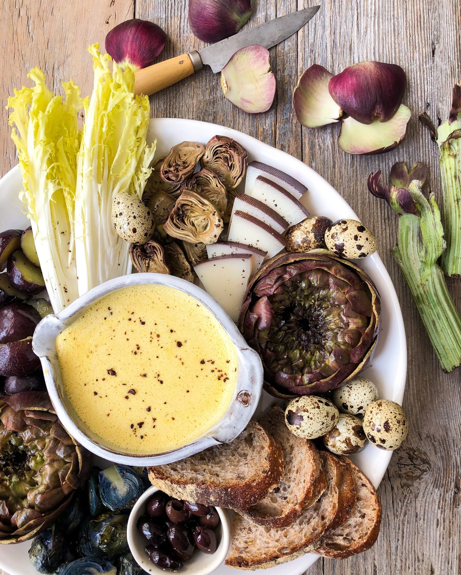 Purple Artichokes with Hollandaise, quail eggs