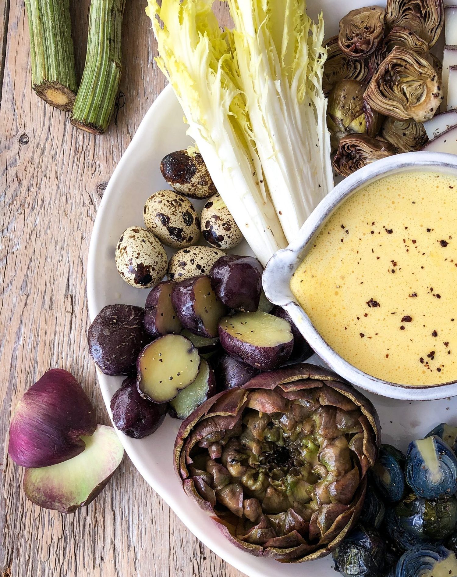 Purple Artichokes, Hollandaise sauce, quail eggs, purple potatoes