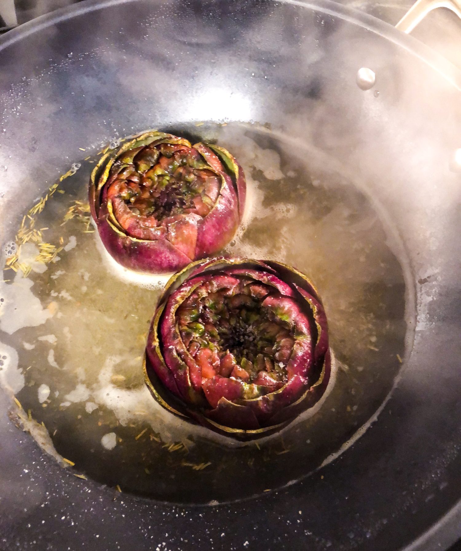 Braising purple artichokes