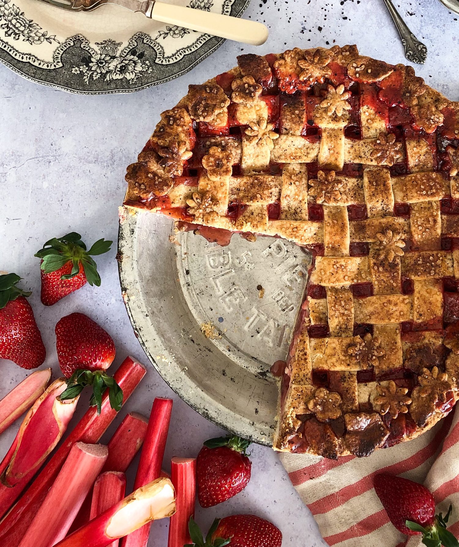 Strawberry Rhubarb Pie with urfa biber in a chocolate coffee marble crust, lattice, flower and leaf cut outs