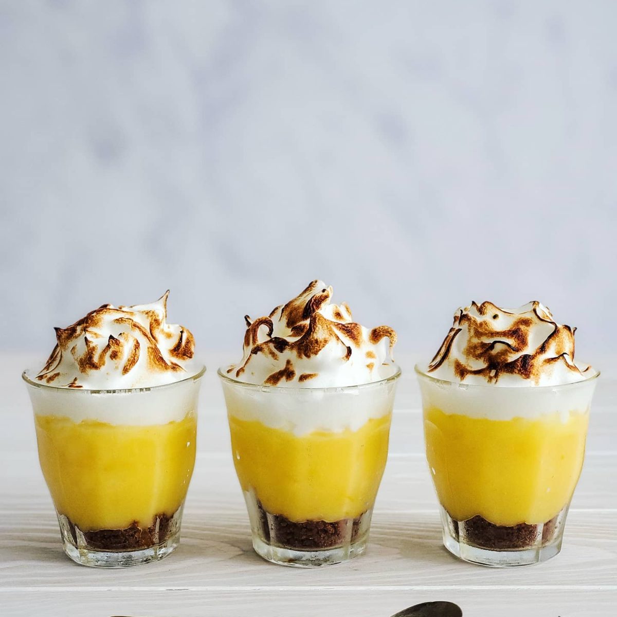 Lemon Meringue Cups with Gingersnap Crust