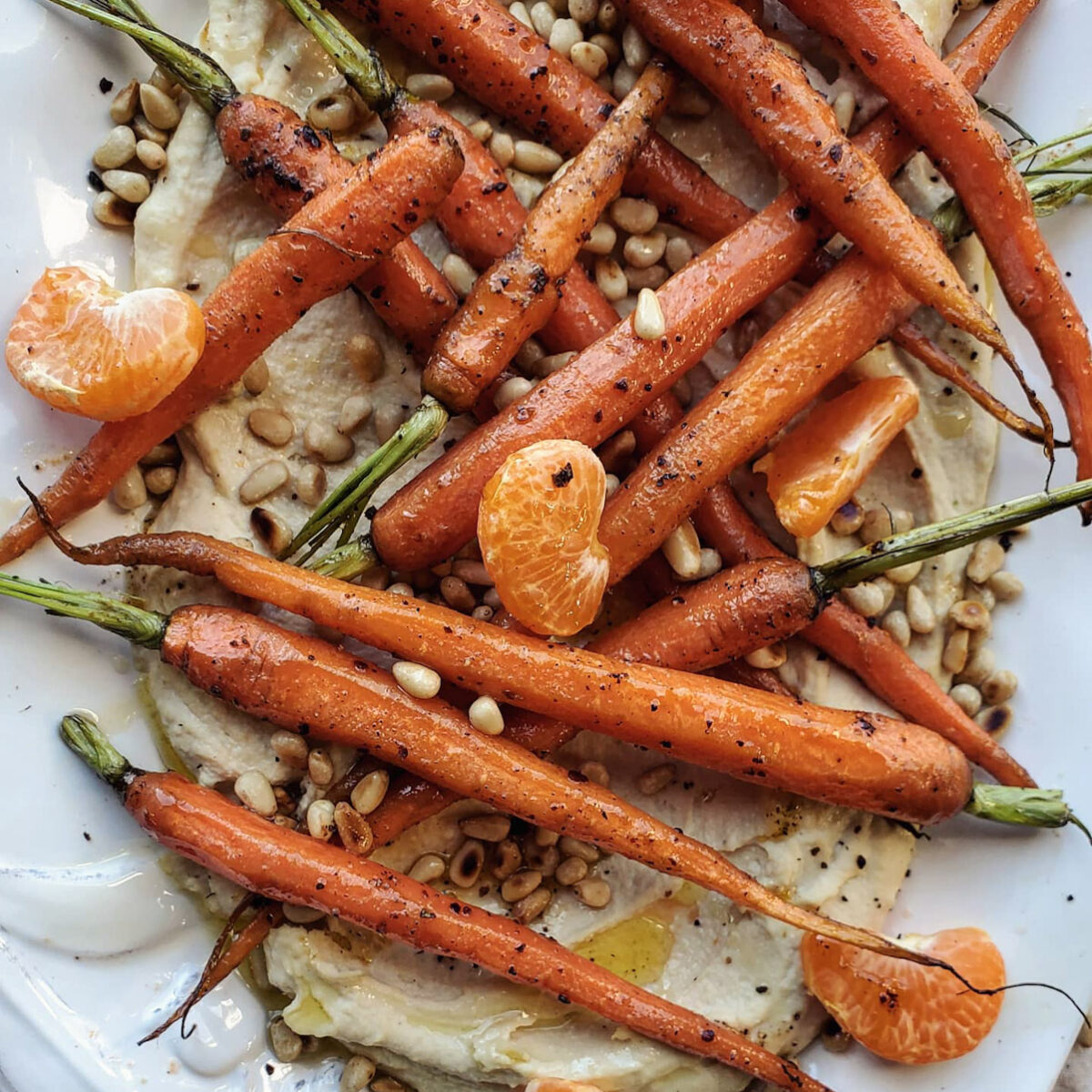 Rose Harissa Roasted Carrots over Hummus