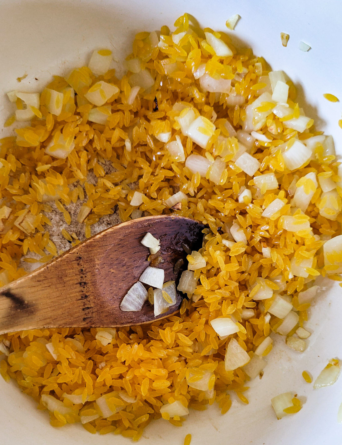 Sautéing onions, garlic and orzotto pasta for Roasted Tomato Orzotto