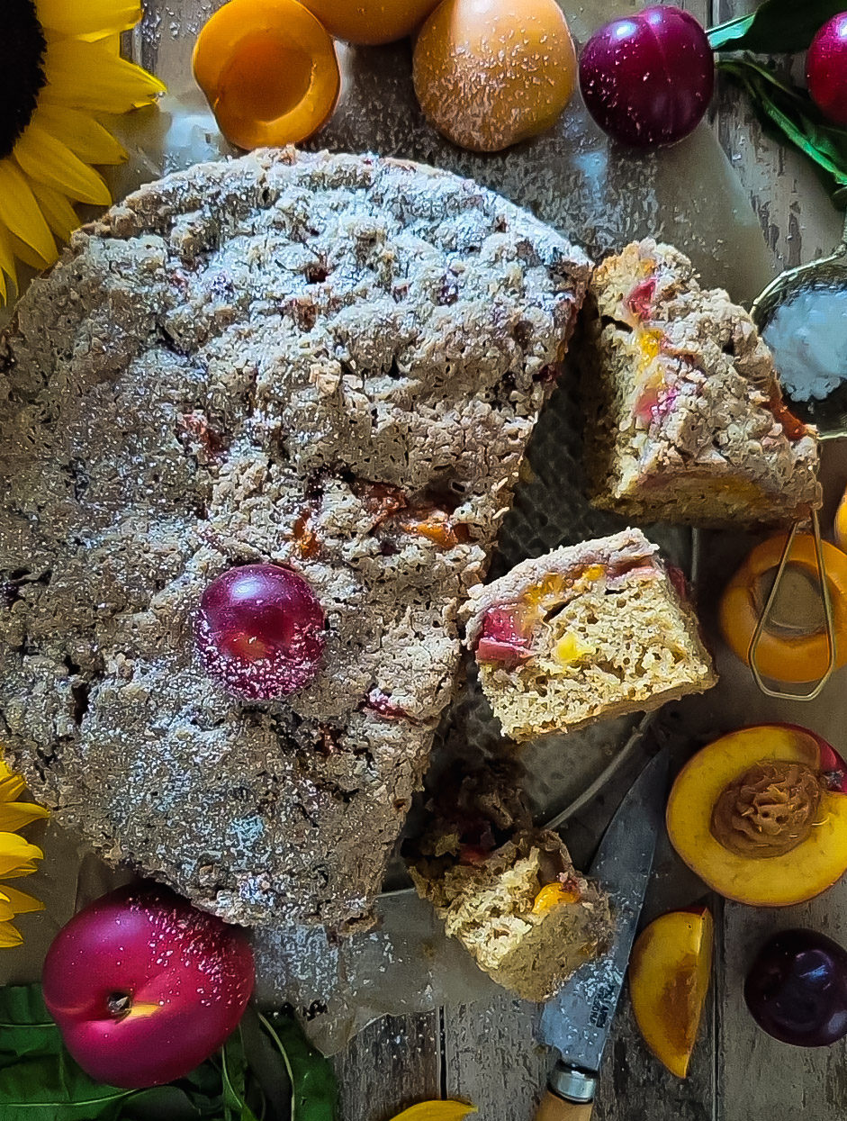 Brown Butter Stone Fruit Streusel Coffee Cake, close up of some slices showing the fruit inside.