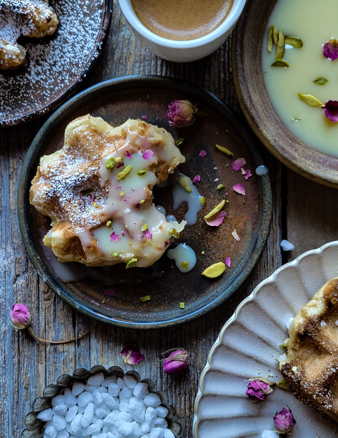 Close up of a Liege inspired Mochi Waffle dipped in white chocolate and pistachio dipping sauce.