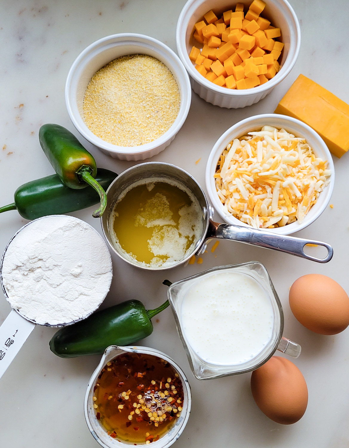 Ingredients to bake Jalapeno Cheddar Cornbread with Hot Honey on the counter.