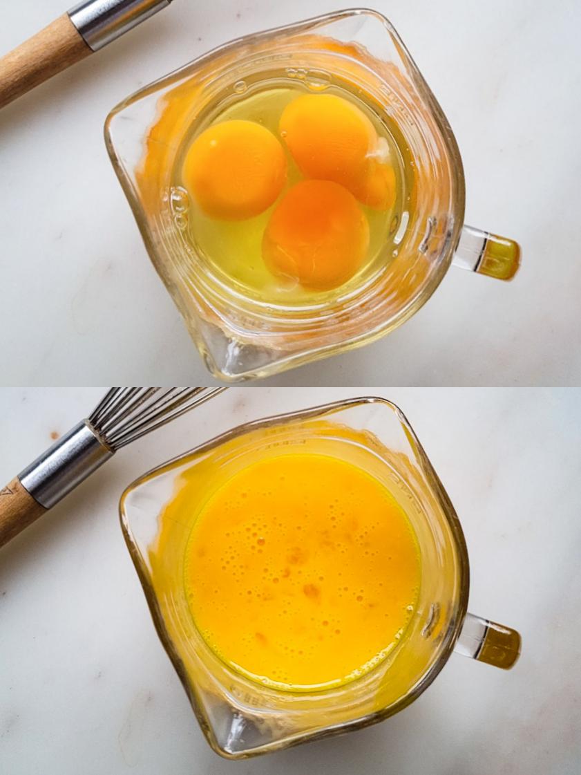 Showing how to get 1 1/2 eggs from 3 eggs for a recipe, viewing the eggs in a measuring cup with a whisk next to it.