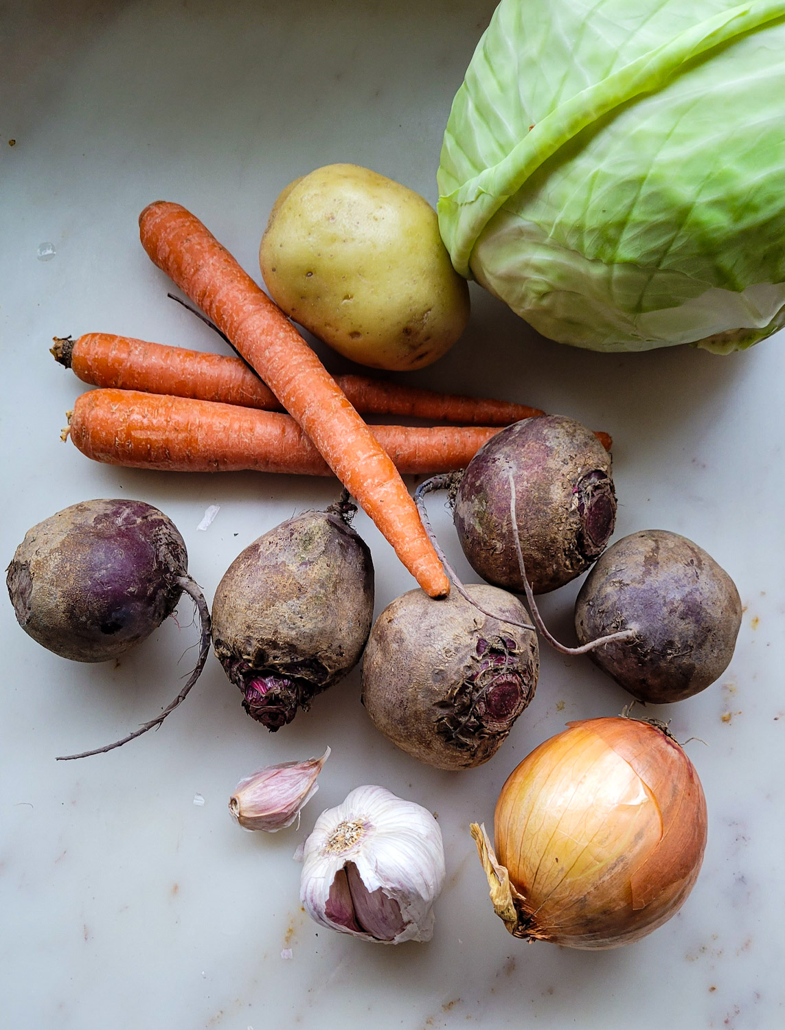 The vegetables needed to make Borscht in Short Rib Stock on the counter.