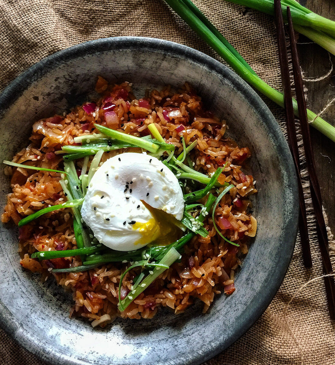 Kimchi Fried Rice topped with Scallion Salad and a poached egg.