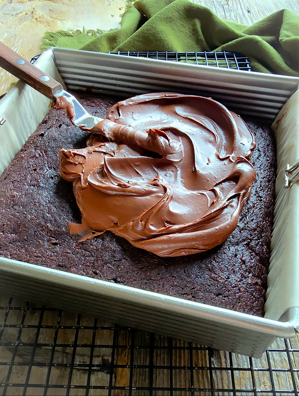 Spreading the Chocolate Ganache on a Chocolate Zucchini Cake.