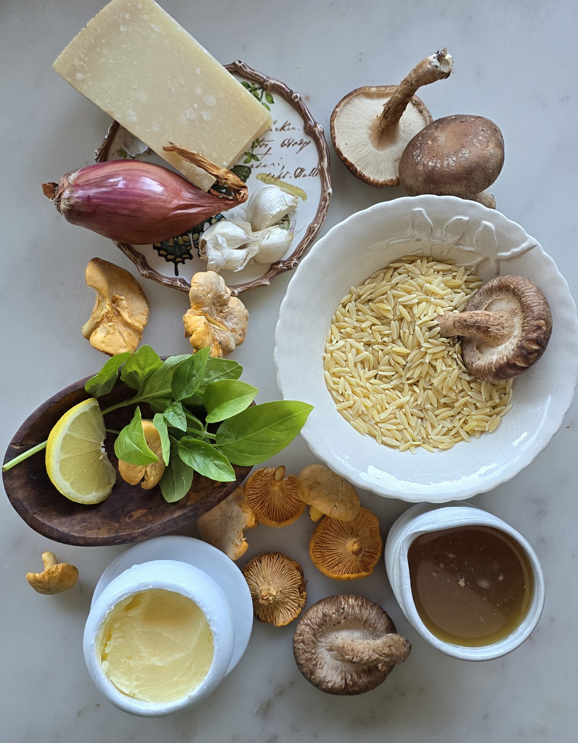 Ingredients needed to make Mushroom Orzo with Brown Butter Crispy Sage spread out on the counter.