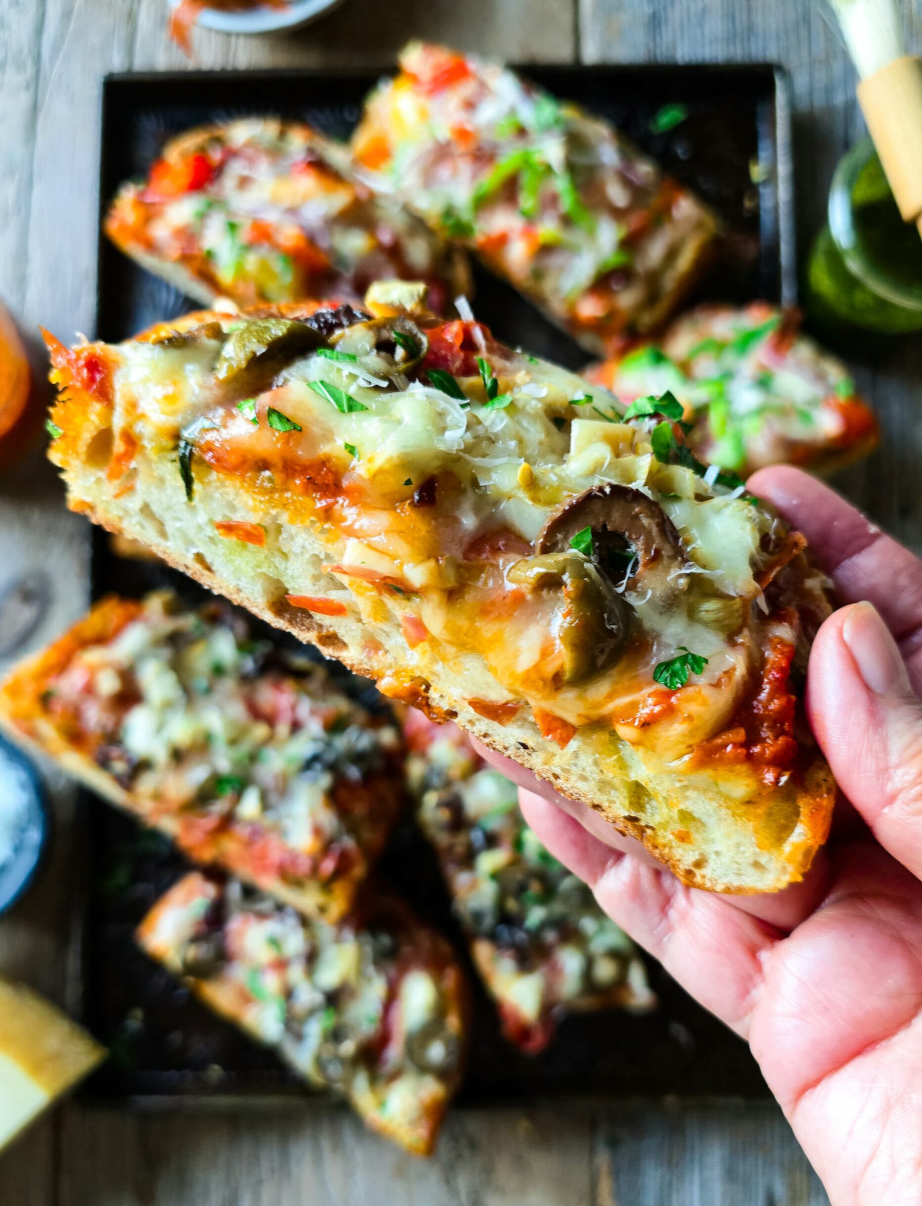 A close up of a slice of French Bread Pizza.