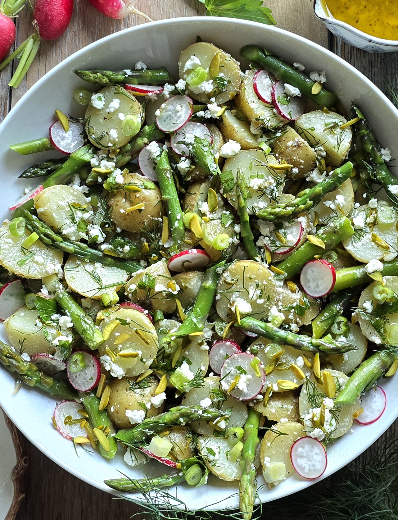 Close up of a bowl of Potato Asparagus Salad with Lemon Honey Vinaigrette.