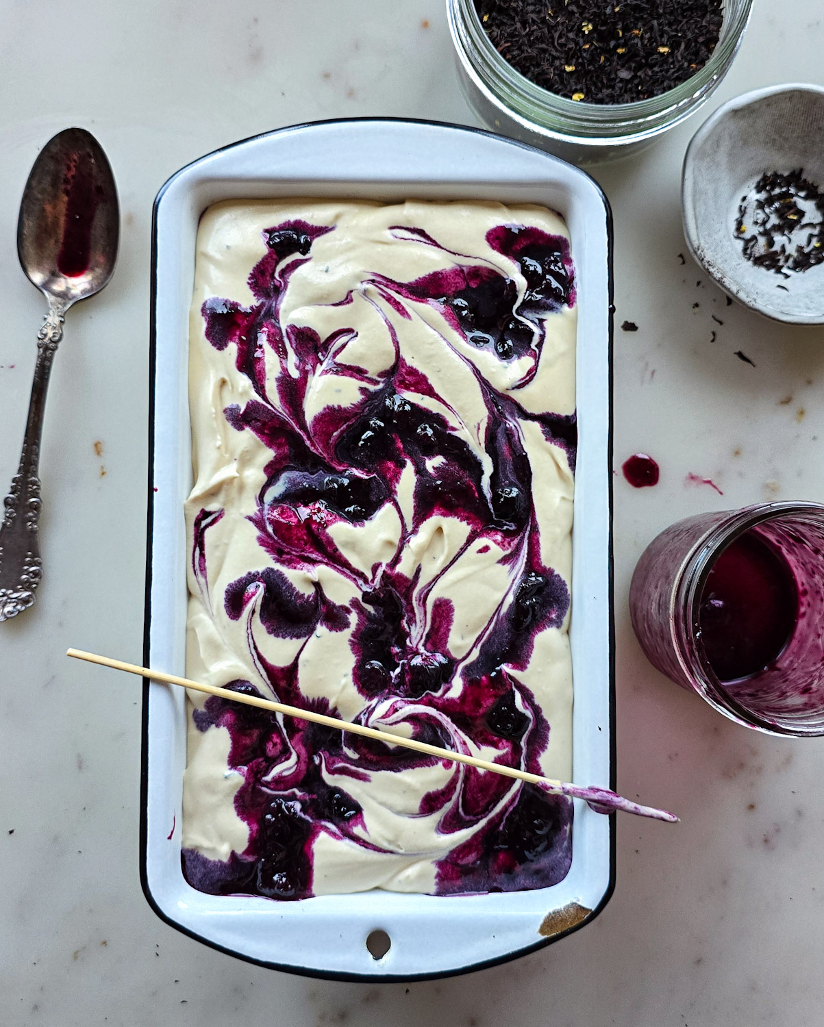 Earl Grey Ice Cream has Blueberry Lavender Swirled through out the cream, and is now ready to go into the freezer.