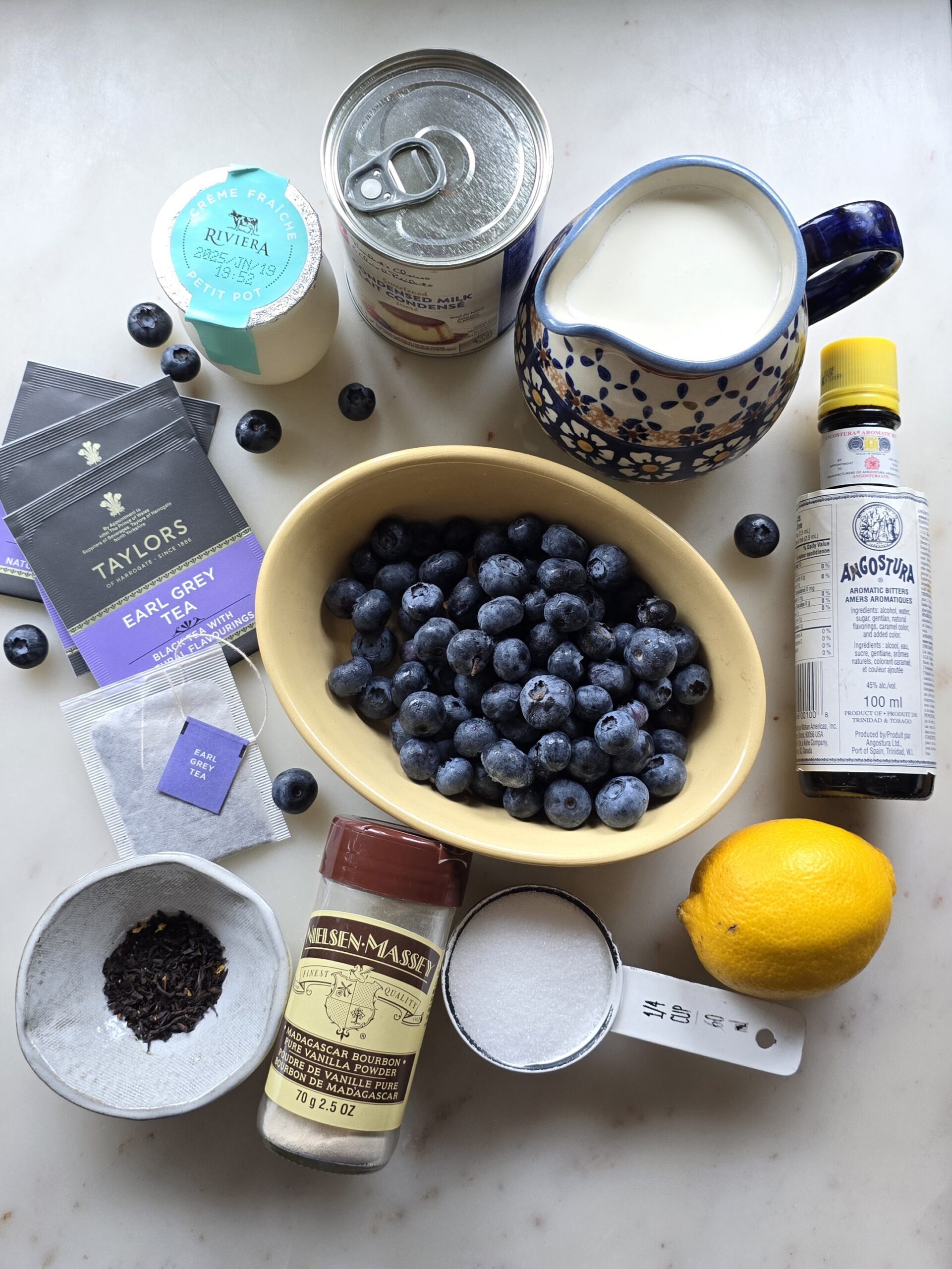 Ingredients needed to make Earl Grey Ice Cream with Blueberry Lavender Swirl are set out on the counter.