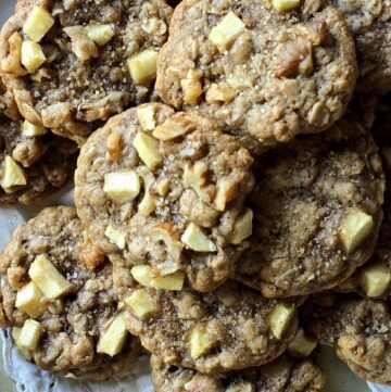 Close up of Chewy Chai Apple Oatmeal Cookies showcasing the chunks of apple, walnuts and raw sugar sprinkles.
